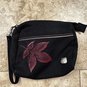 Small Haiku Bag. Black with burgundy detail.
